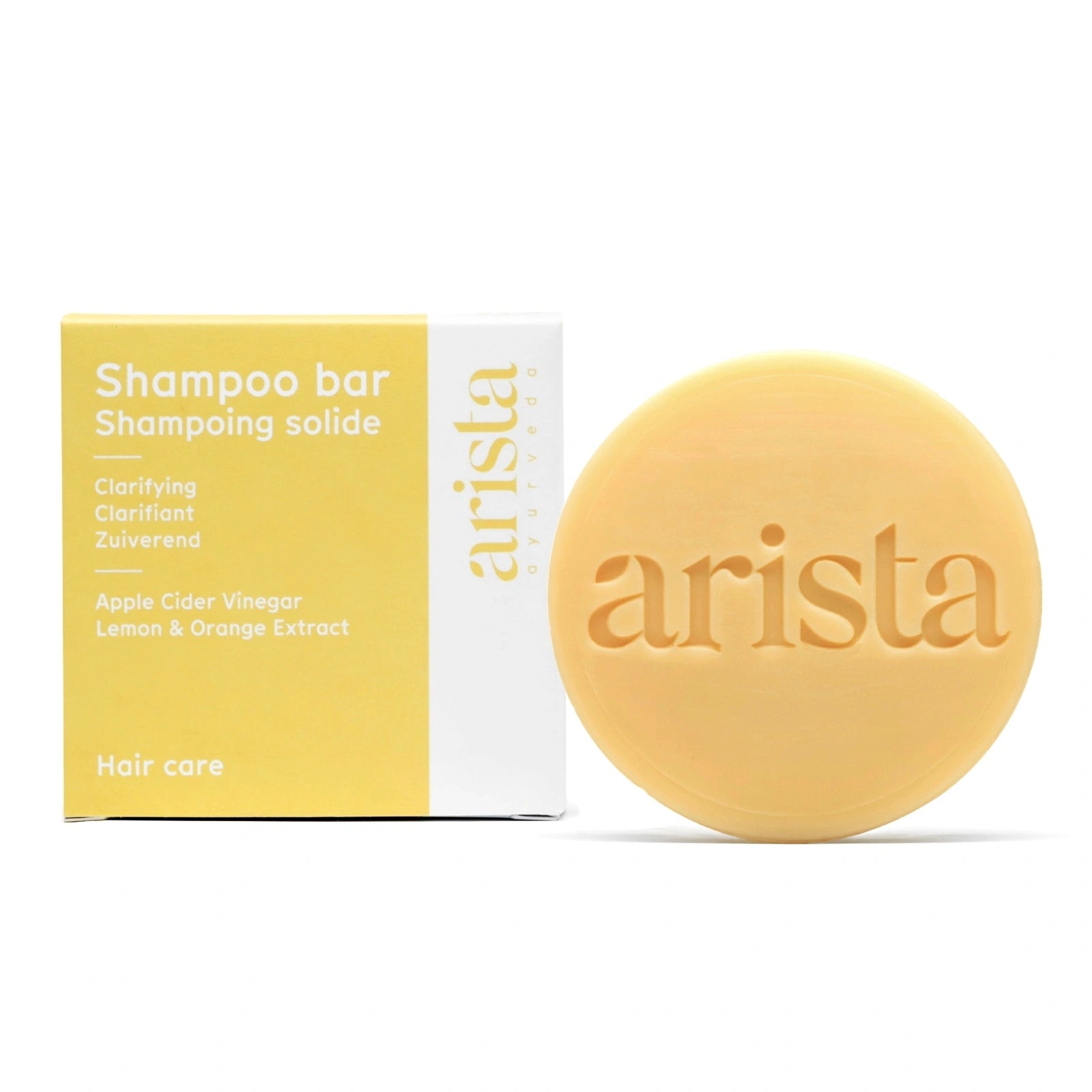 Arista clarifying shampoo bar and packaging on a white background