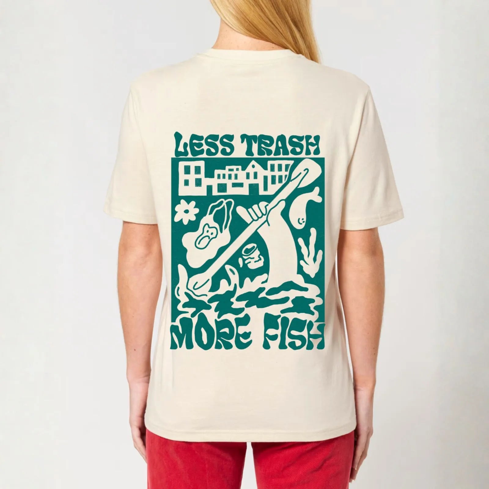 A woman wearing a City to Ocean T-shirt with &#39;Less Trash More Fish&#39; graphic design on the back. 100% Cotton in natural raw white, untreated sustainable fabric