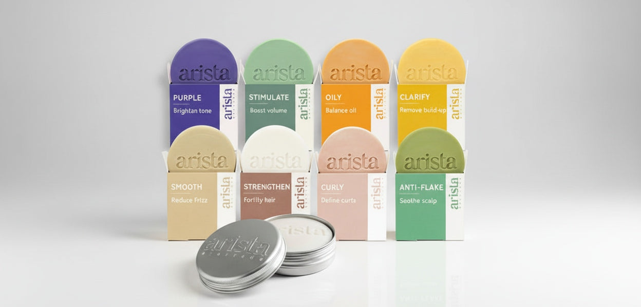 Collection of Arista hair care products on a white background