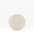 White shaving bar with a subtle embossed pattern on a pale background